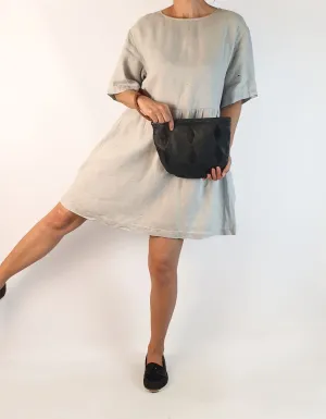 Nancybird soft leather navy clutch with brown wrist strap
