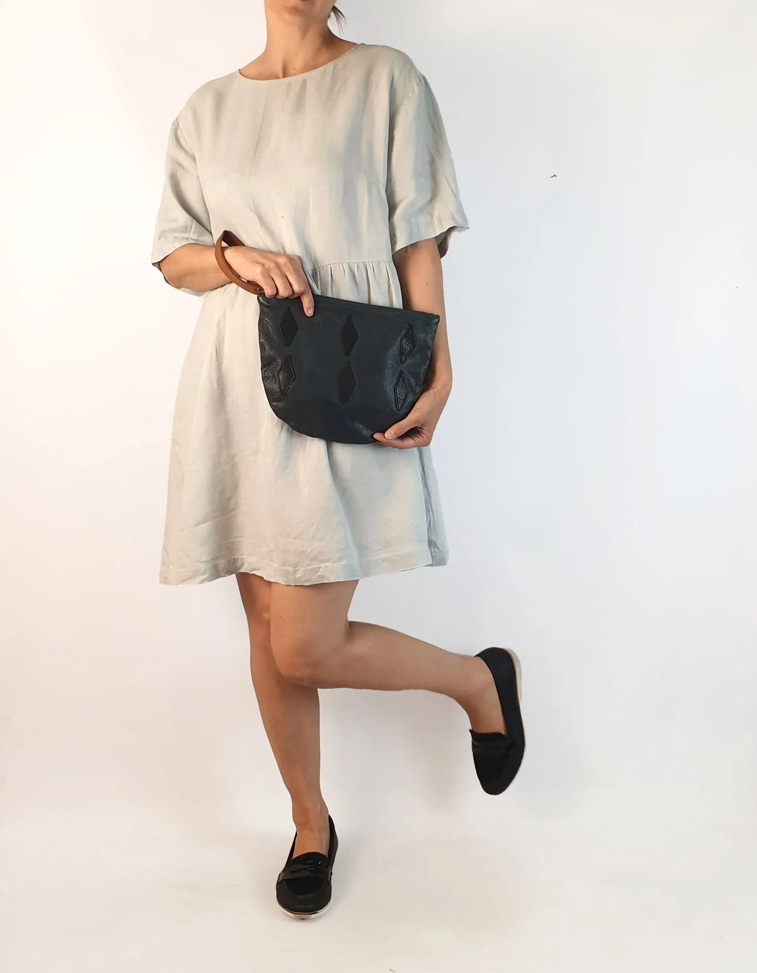 Nancybird soft leather navy clutch with brown wrist strap