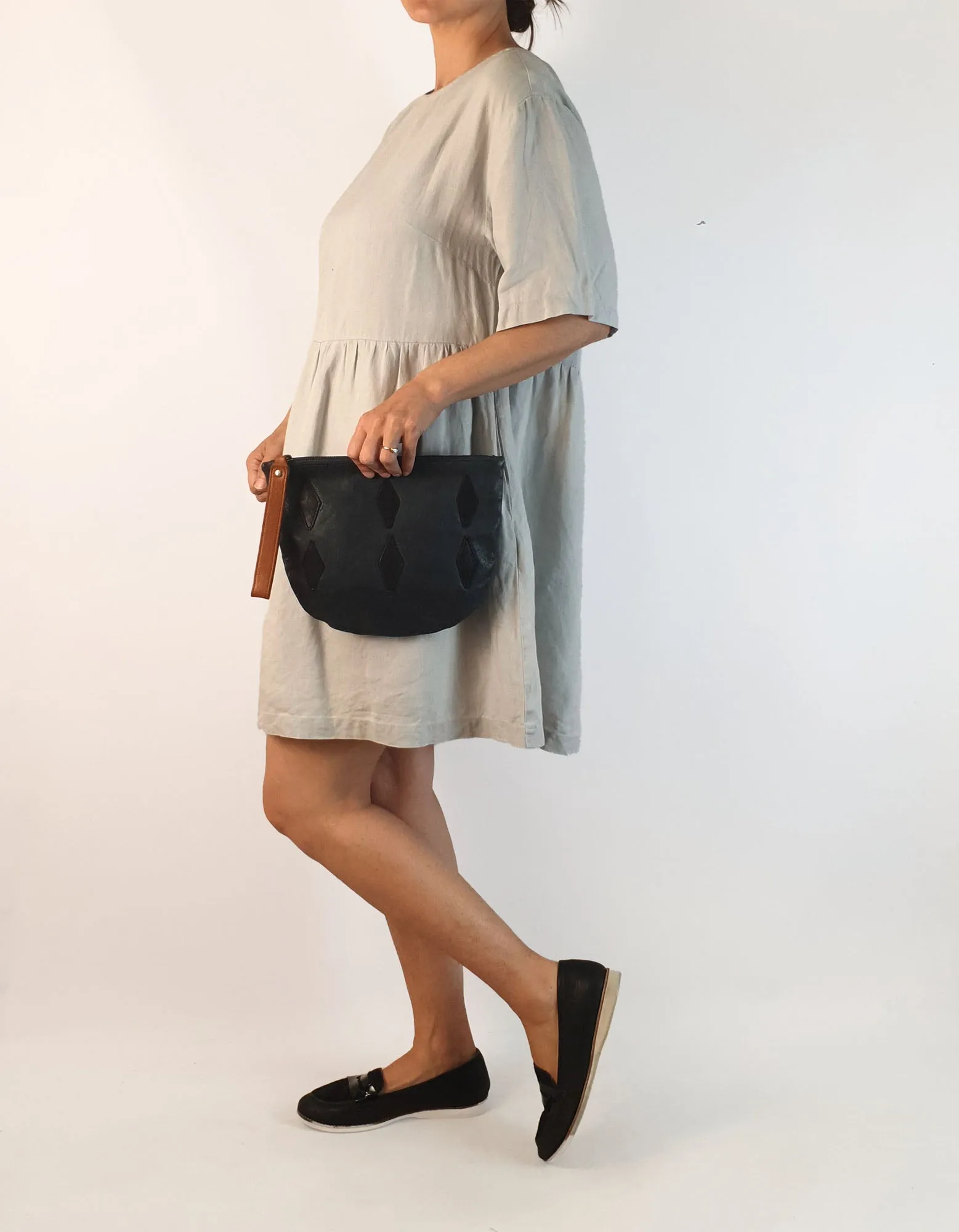 Nancybird soft leather navy clutch with brown wrist strap