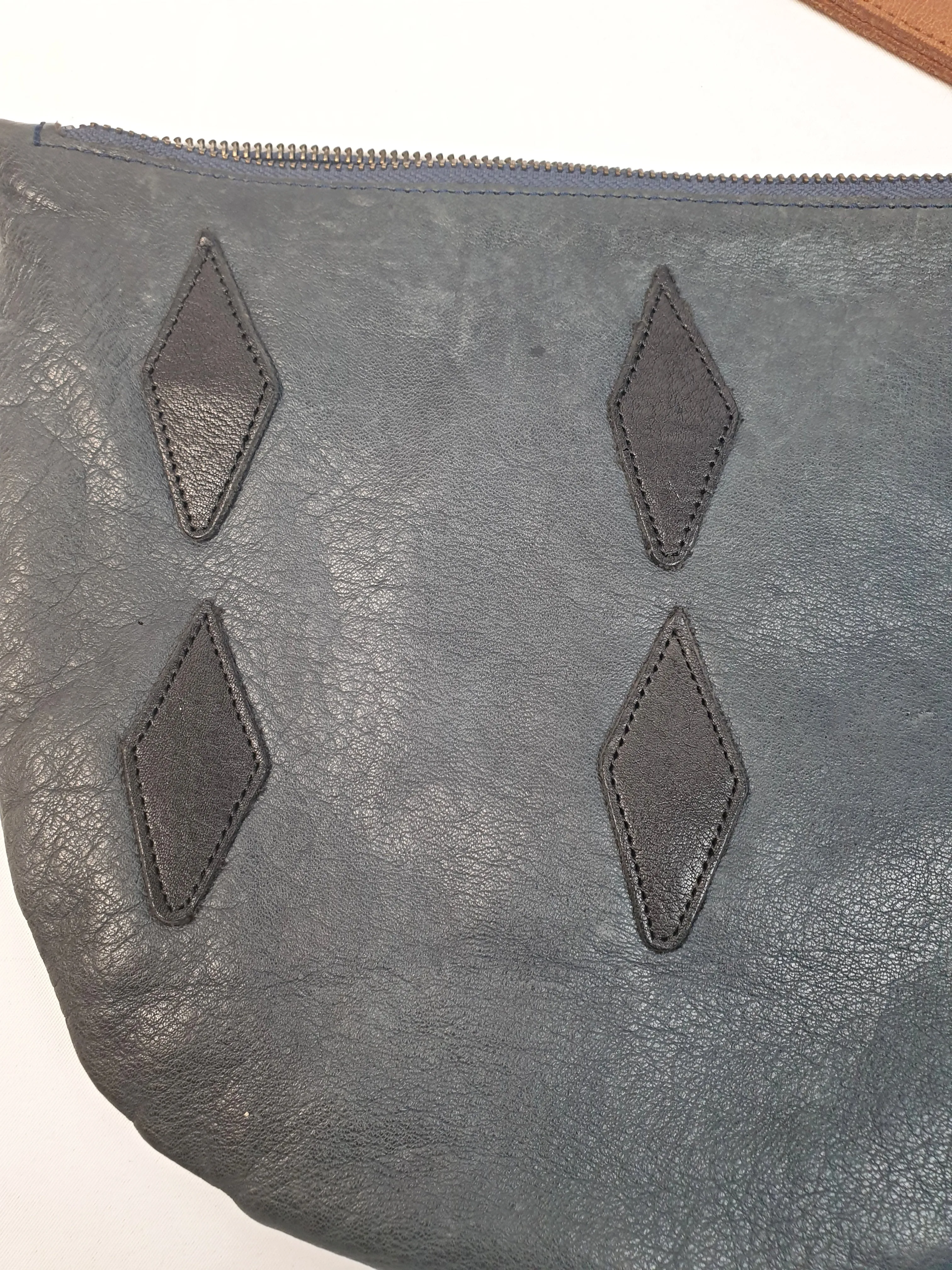 Nancybird soft leather navy clutch with brown wrist strap